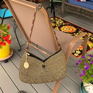 Stunning woven, black and tan straw handbag by Straw Studios.